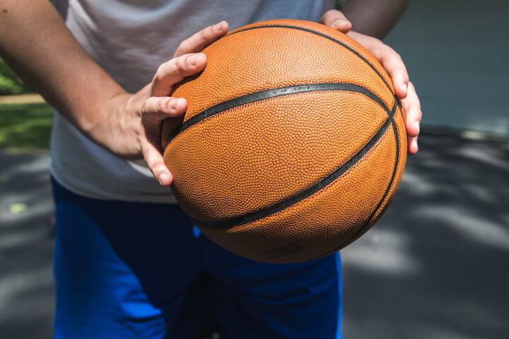Player-holding-a-basketball Player-holding-a-basketball