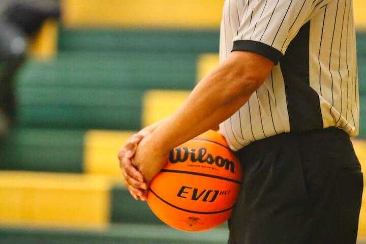 Basketball Referee Signals referee-holds-the-basketball-during-a-game