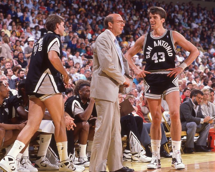 nba-basketball-coach-on-sideline-with-players NBA basketball coach on the sideline with his players.